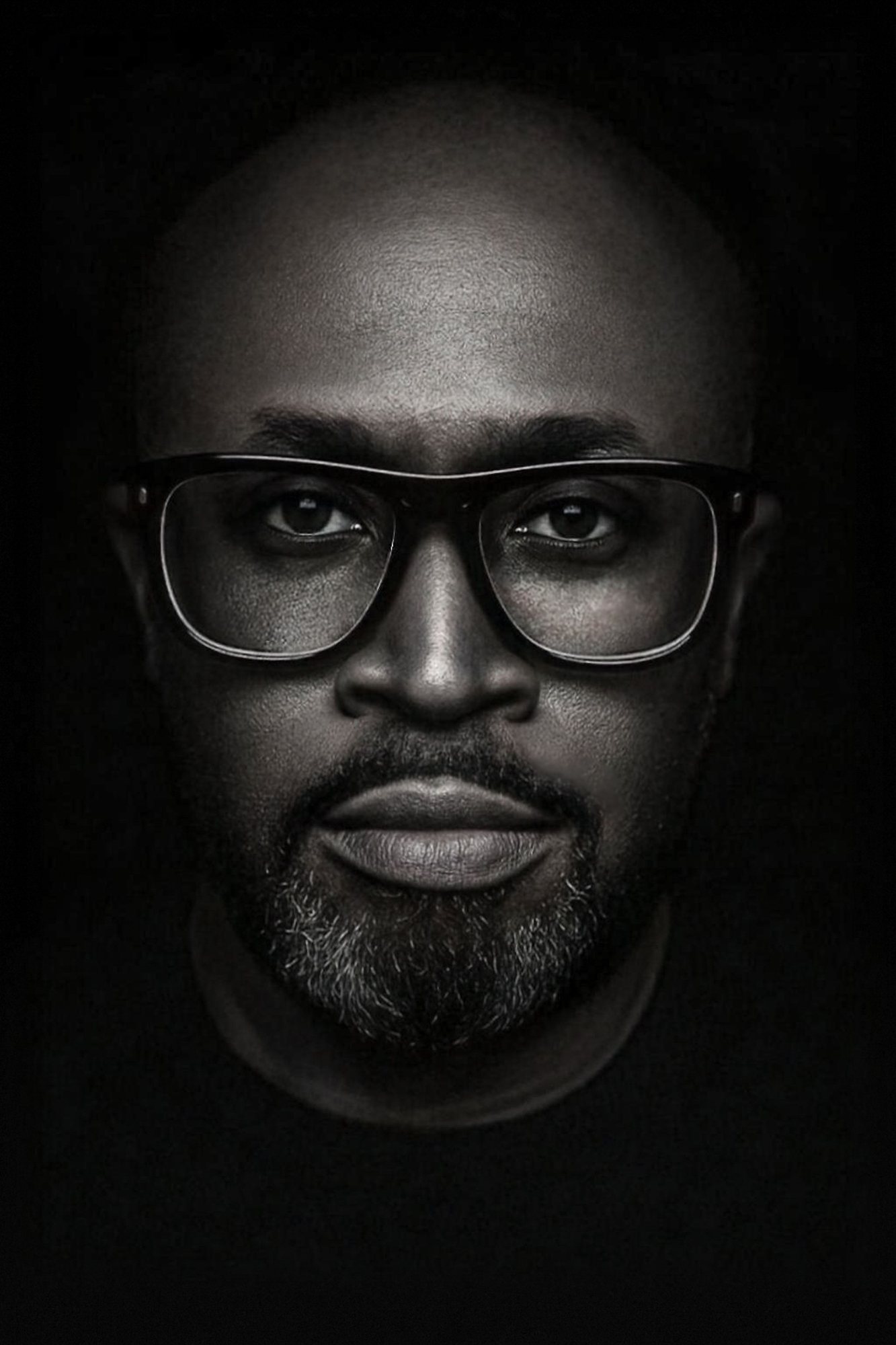 Black and white portrait of Rich Barr in dark rimmed glasses