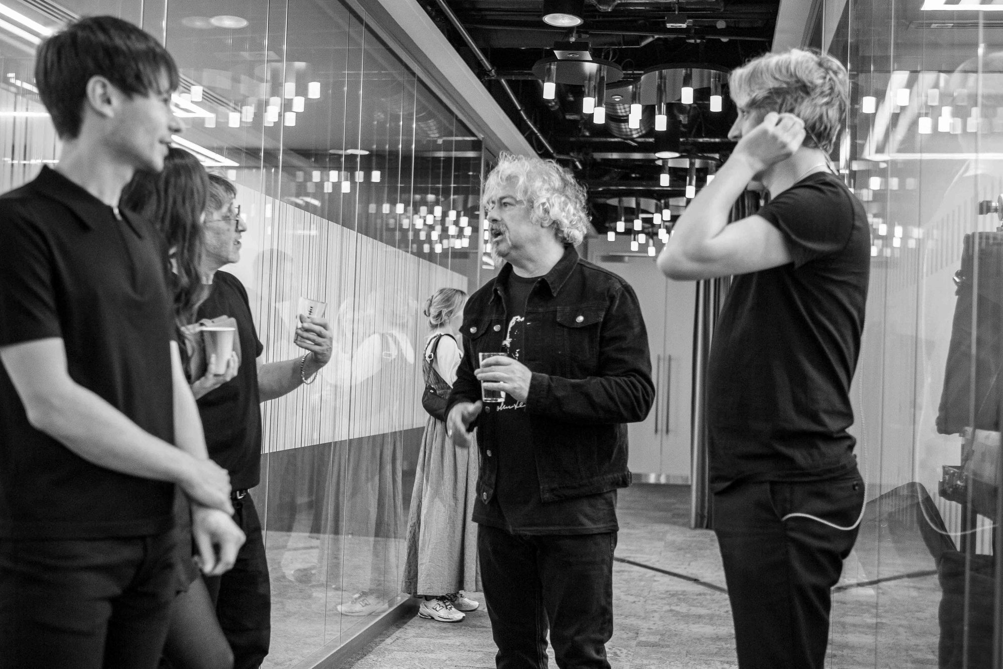 Black and white photo of a band backstage before a show