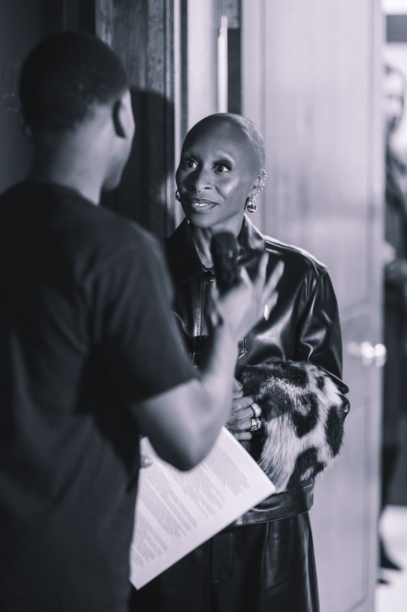 Black and white photo of two guests in conversation