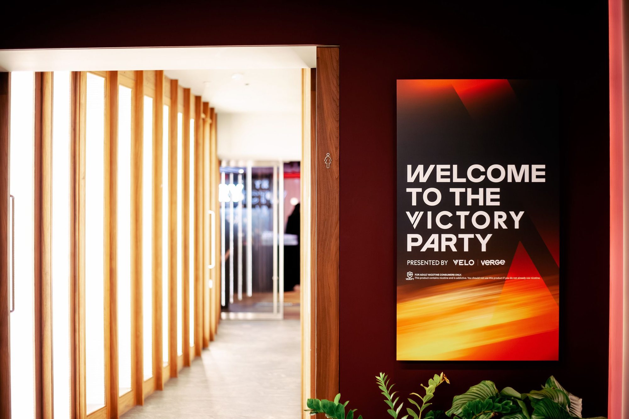 Welcome to the victory party sign in a hotel corridor